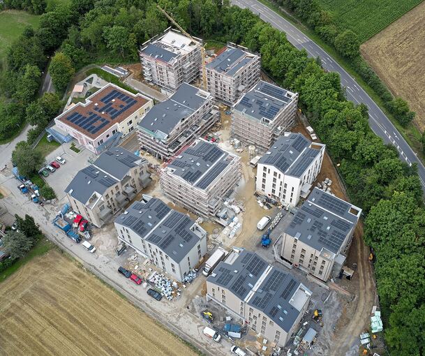 Das Wohnquartier „Freiraum“ aus der Vogelperspektive. In dem zweistöckigen Flachdachgebäude links befindet sich eine Kindertagesstätte.
