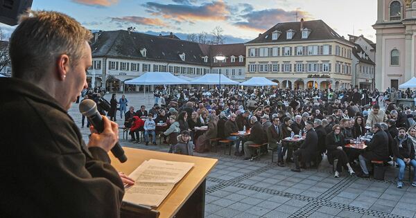 Muslims celebrate breaking the fast together in the market square