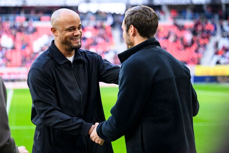 Vincent Kompany (l) und Julian Schuster (r)